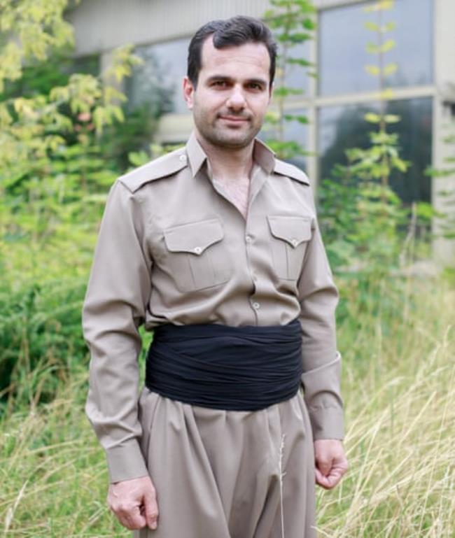 A portrait of a man outside.
