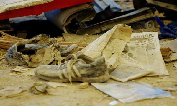 Shoes are sen among the remains and damage to a Staten Island Ferry in
New York, October 16, 2003, the day after it crashed into a pier.