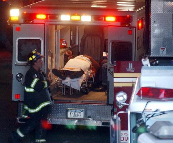 One of the injured is put in an FDNY ambulance, or bus, at the terminal.