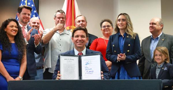 DeSantis signing HB 621 in Orlando on March 27, 2024.