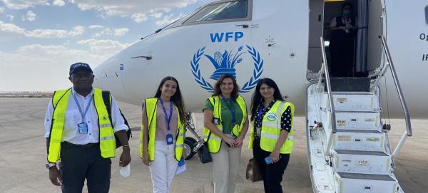 UNHAS crew members pose outside an aircraft at Qamishli airport in northeastern Syria. UNHAS crew members pose outside an aircraft at Qamishli airport in northeastern Syria.