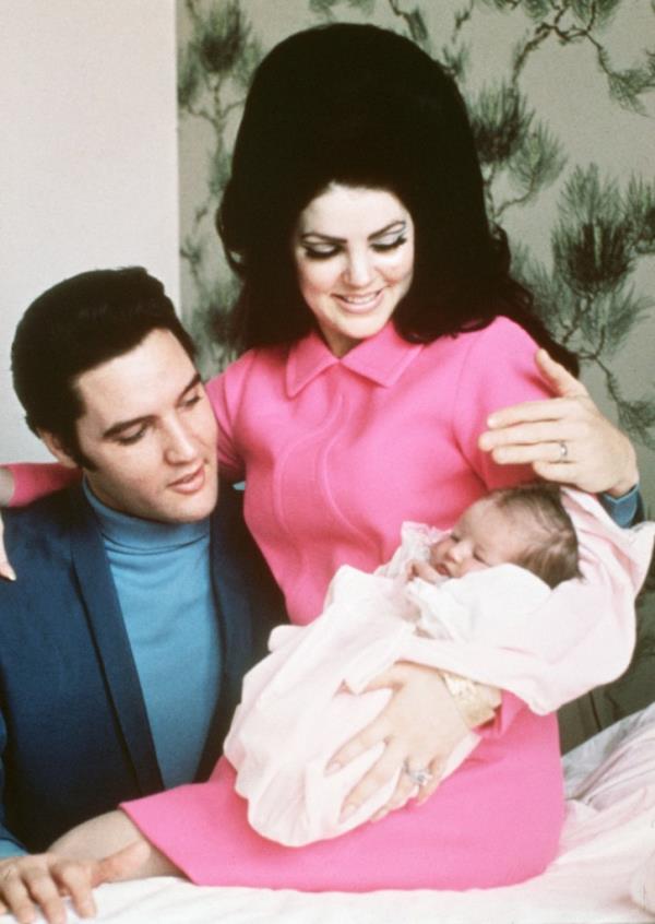 Elvis Presley and his wife, Priscilla, prepare to leave the hospital with their new daughter.