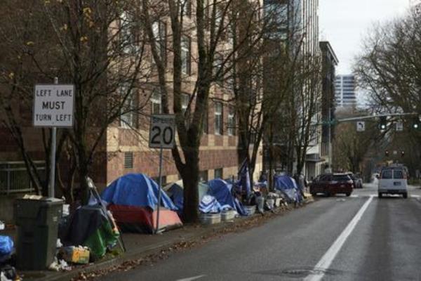 Tents line a sidewalk in Portland, december 2020, when a record number of homeless deaths were driven by meth and fentanyl.