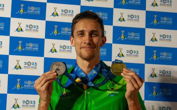 Cook Islands swimming record breaker Wesley Roberts with his medal haul. Photo: Team Cook Islands