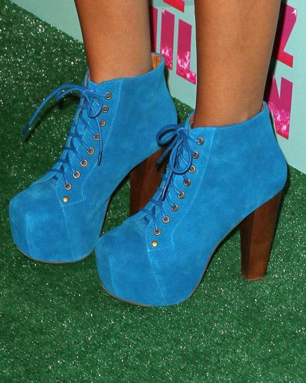 Ashley Tisdale at Perez Hilton's Mad Hatter Tea Party Celebration in Los Angeles, wearing blue high heeled boots on 24 Mar 2012